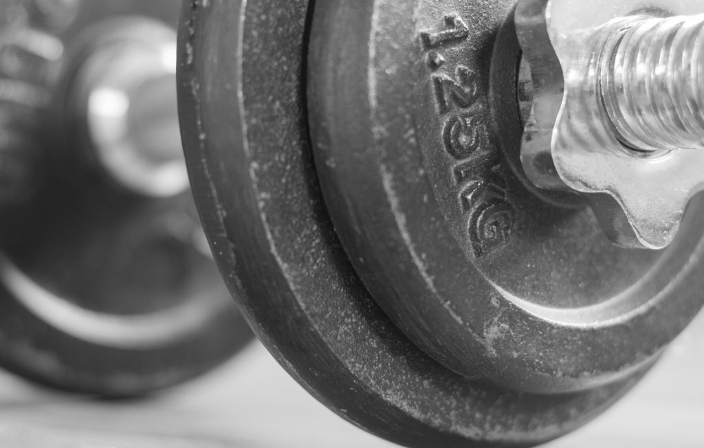 Close-up of a dumbbell weight plate in a fitness studio