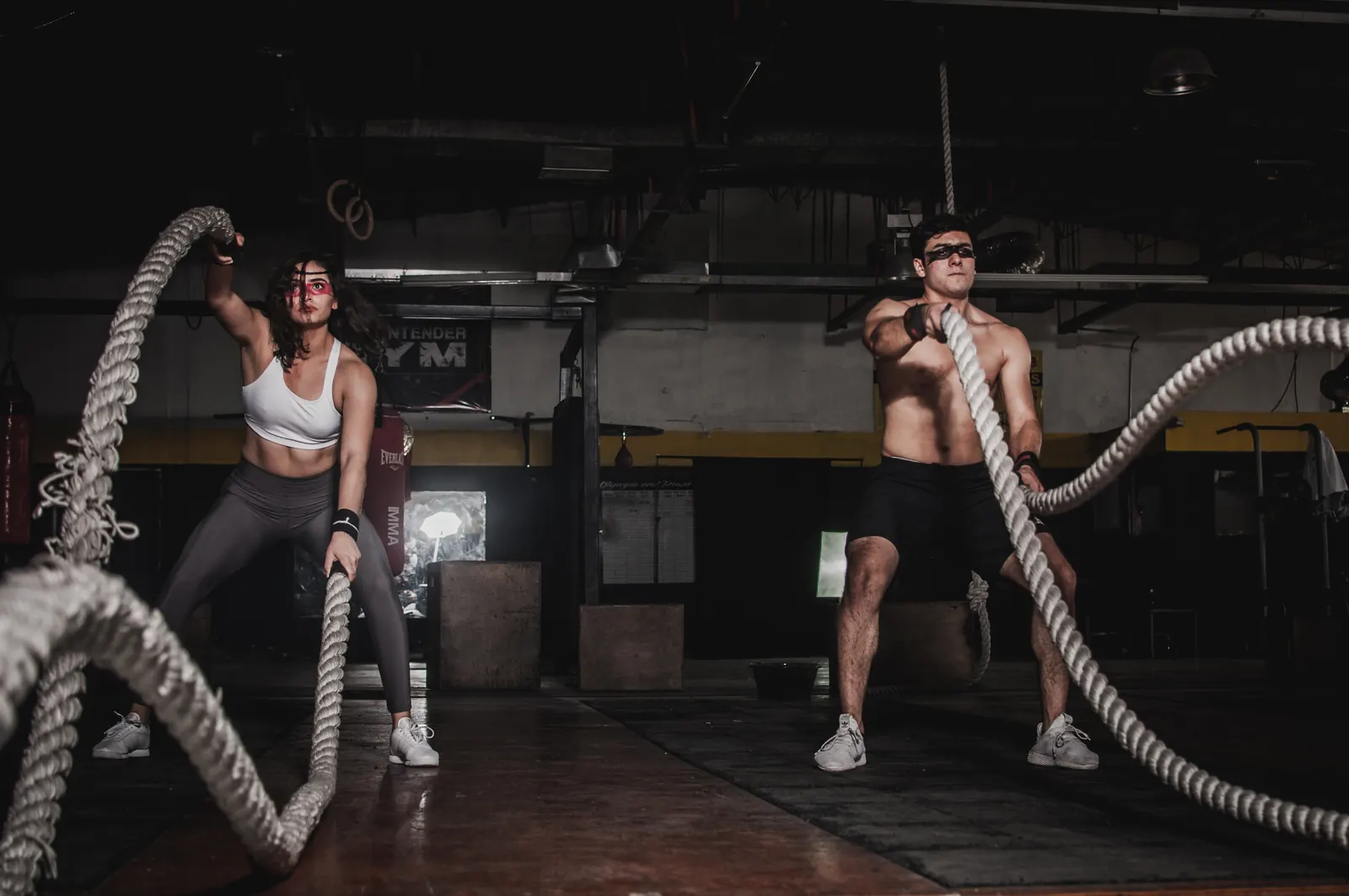 Two athletes doing a battle rope HIIT workout