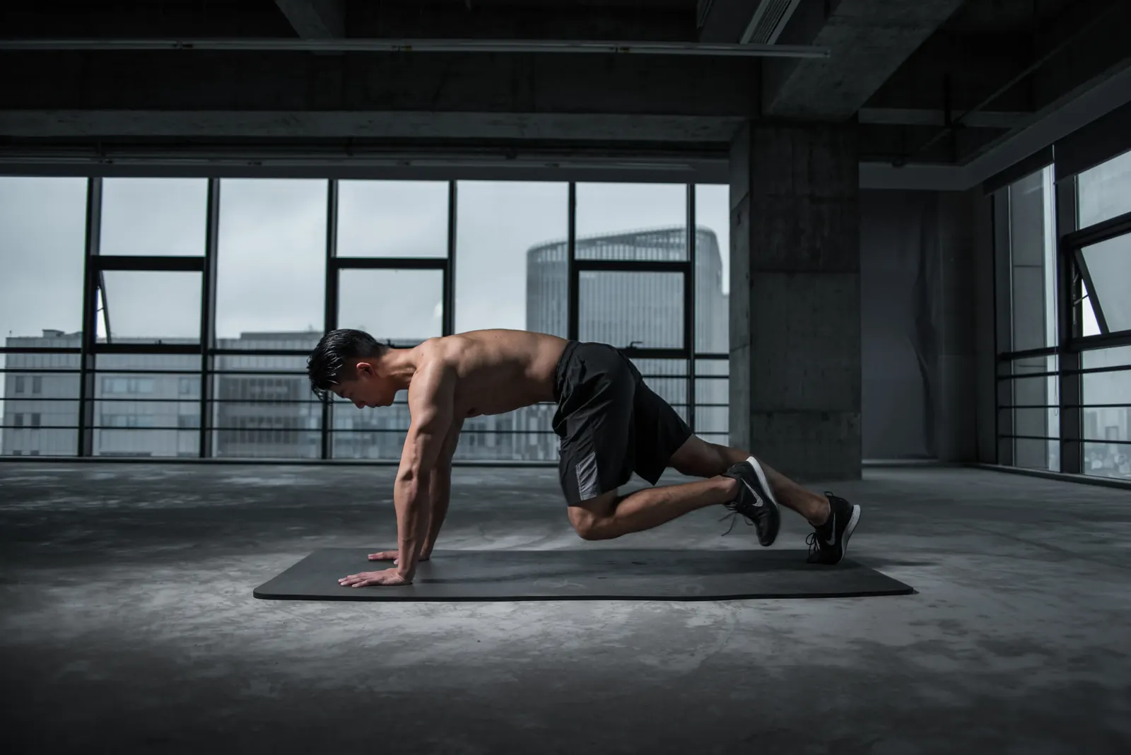 Man holding a plank during a beginner full-body home workout